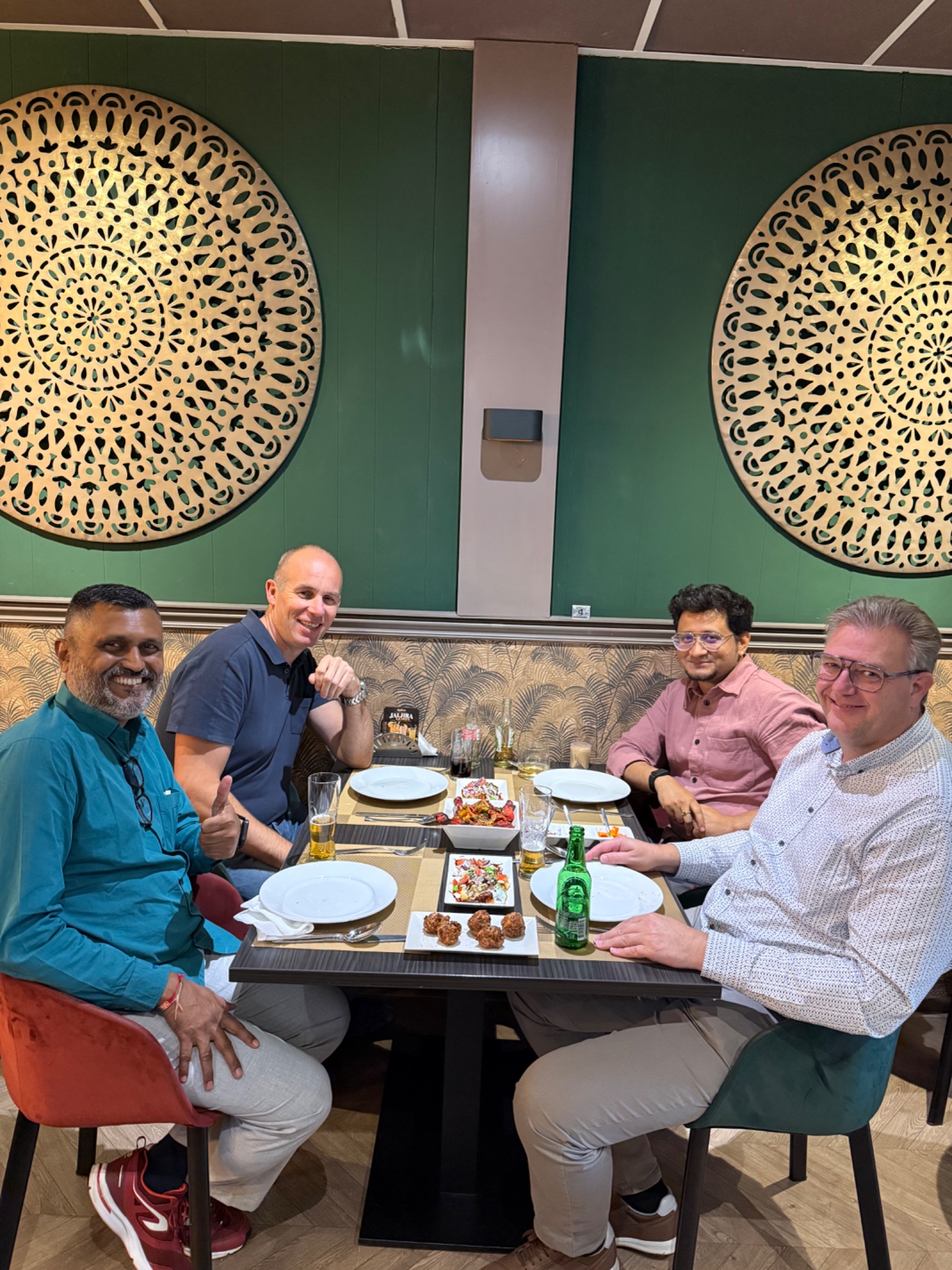 Xander Heijnen with colleagues around a table outside the working sessions